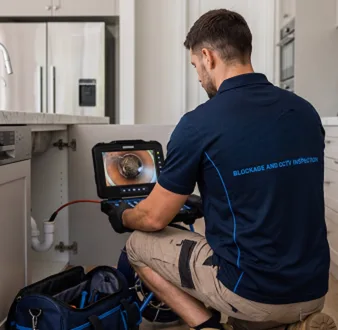 Blocked toilet being cleared with proper equipment